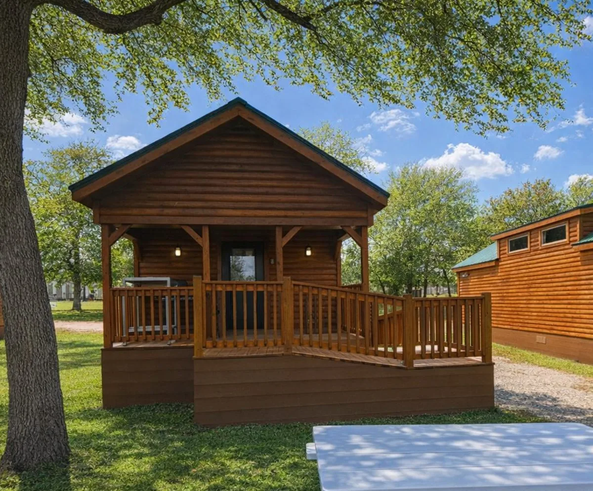 Cabin #7 at Al's Hideaway — log cabin with wide covered porch and ramp